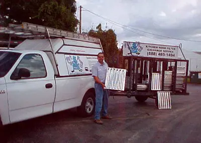 David A. Nowack with early company service vehicles