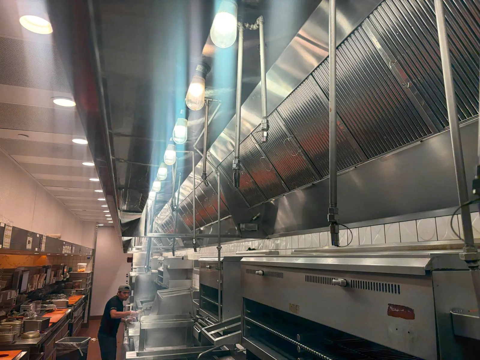 A completed commercial kitchen exhaust hood serviced by Fat Free KEC